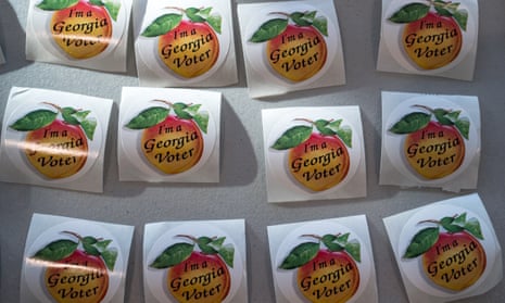 Election stickers showing a peach and the words 'I'm a Georgia voter.'