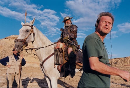 On location the actor, wearing armour, sits astride a horse while the director stands with his back to him, looking concerned