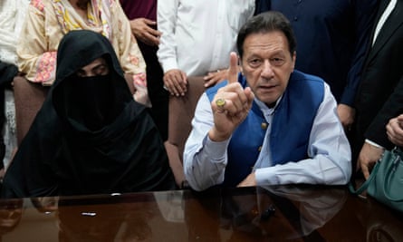 Imran Khan, right, and Bushra Bibi at an office of Lahore high court, July 2023