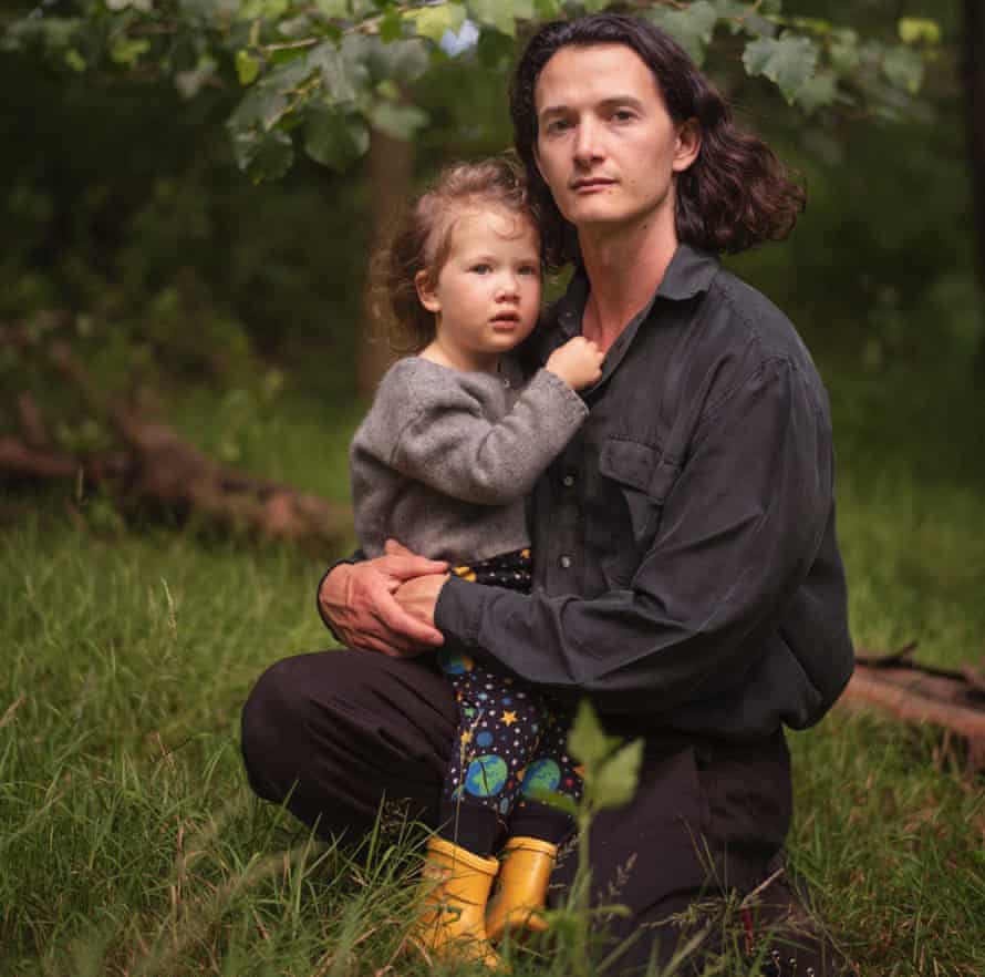 Charlie Gilmour with his two-year-old daughter.