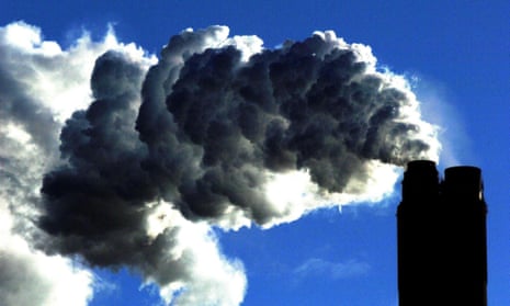 A coal plant pumps fumes into the sky
