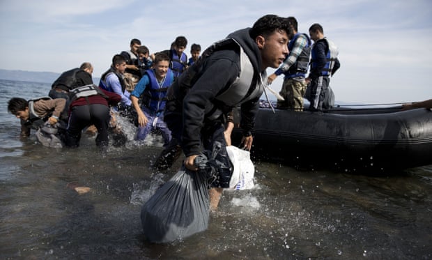 Afghan people arrive on the shores of the Greek island of Lesbos.