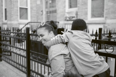 Evelyn, aged 42, carrying a kid connected her back