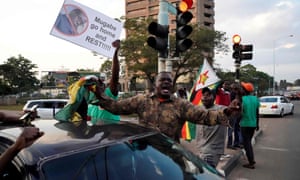 People celebrate the resignation of Zimbabwe’s president Robert Mugabe, Harare, November 2017