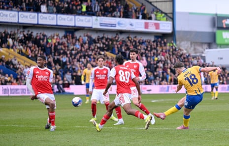 Mansfield Town's Rhys Oates (right) attempts a shot on goal.