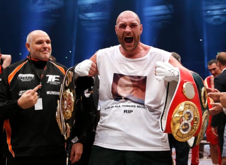 Tyson Fury celebrates with Peter Fury.
