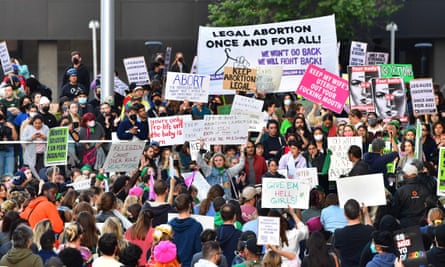 Pro-choice activists gather in downtown Los Angeles after the draft supreme court opinion was leaked.
