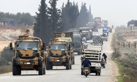 A Turkish military convoy travels through the east of Idlib, Syria
