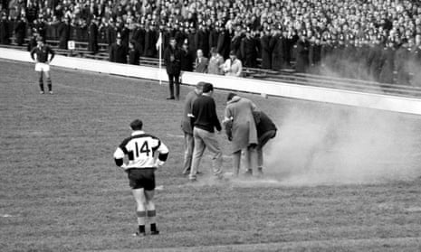 Anti-apartheid demonstrators throw a smoke bomb on to the Twickenham pitch