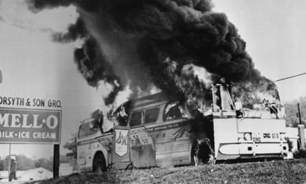 A Freedom Rider bus burns near Anniston, Alabama in May 1961.