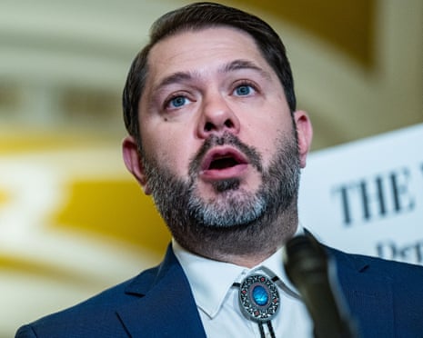 man in blue jacket speaks