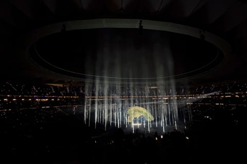Kanye West, or Ye, performs on a stage designed to look like a globe, with beamed lights around it, in the largest concert venue of Riyadh Air Metropolitano stadium in Madrid, Spain. qhxidiqxkiqtdinv