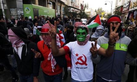Palestinians protest in the West Bank town of Hebron on 13 December against Trump’s decision to recognise Jerusalem as the capital of the Israel last week.