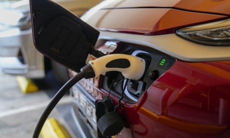 An electric car charges at a supermarket carpark in Sydney