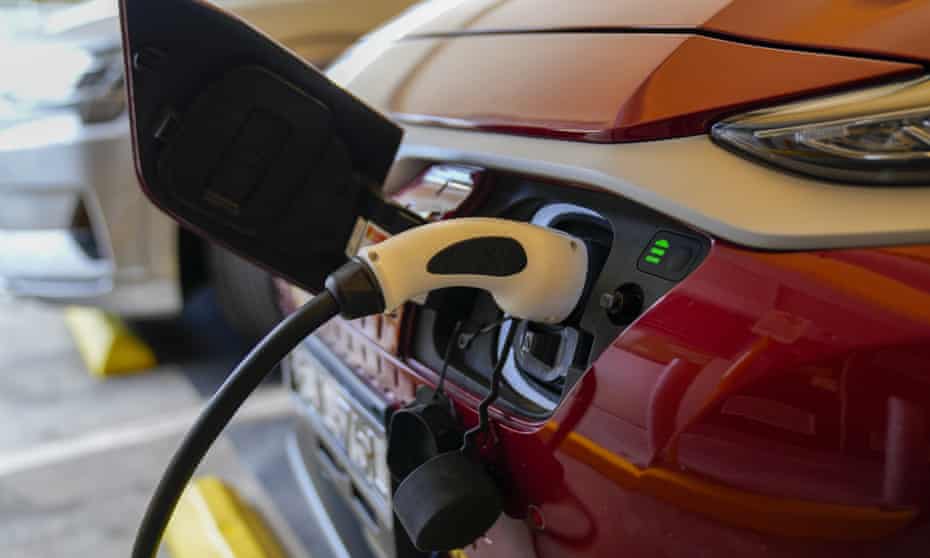 An electric car charges at a supermarket carpark in Sydney