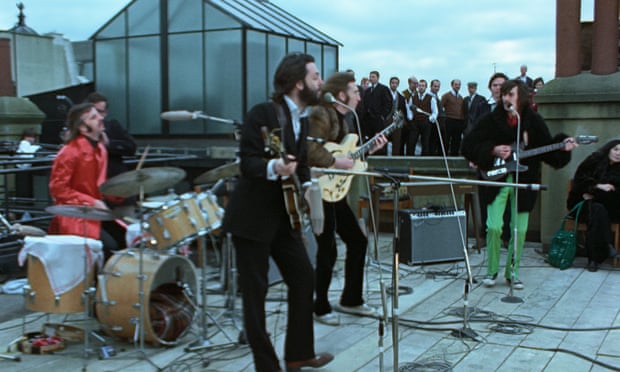 The Beatles play atop the Apple Offices in London in 1969.