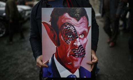 Protesters in Istanbul portray Emmanuel Macron as a devil on 30 October.
