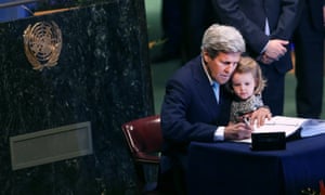 The US secretary of state, John Kerry, holds his granddaughter for the signing of the accord at the United Nations Signing Ceremony for the Paris Agreement climate change accord in New York.