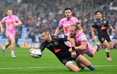 Harvey Skinner scores Exeter’s third try under pressure from Tyrone Green.