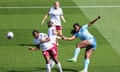 Khadija Shaw scores one of her two goals during Manchester City’s victory