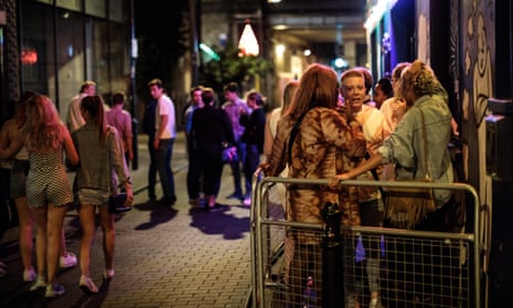 People gathering outside a bar in east London.