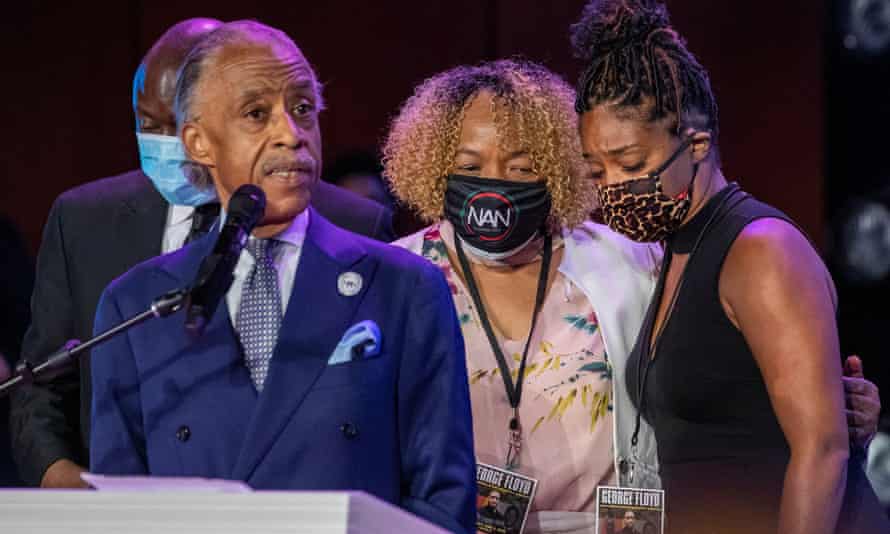Actor Tiffany Haddish hugs Eric Garner’s mother, Gwen Carr, while Reverend Al Sharpton speaks during a memorial service for George Floyd.