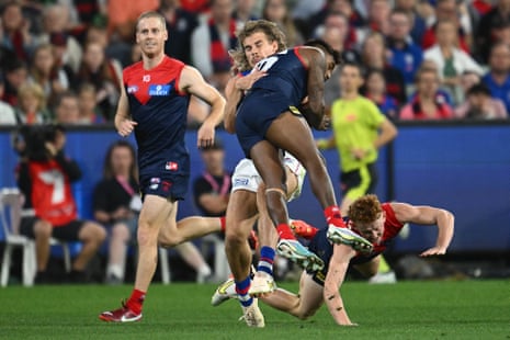 Kysaiah Pickett bumps Bailey Smith during the AFL match between Melbourne and the Western Bulldogs at the MCG.