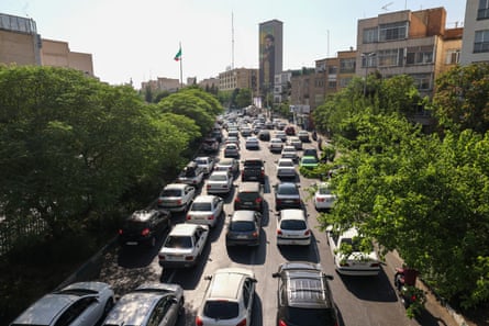 People attempt to leave Tehran through an artery in the city’s west