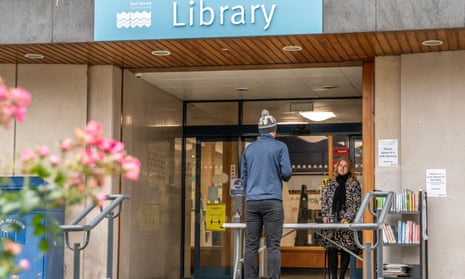 A reader uses Eastbourne public library’s click-and-collect service during lockdown in November.