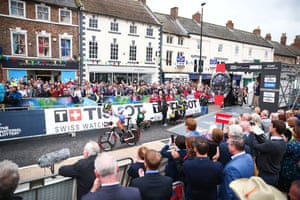 The crowds at the start in Northallerton watch the rider take off.