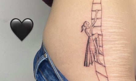A tattoo of a woman climbing a ladder, drawn on top of faded self-harm scars