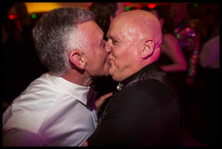 A couple kiss at the Coming Back Out ball.