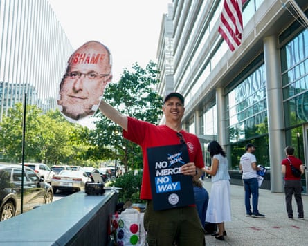 Man holds up sign