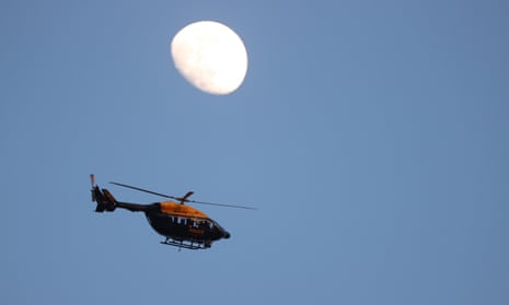 A Police helicopter hovers above the stadium