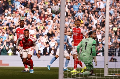 Manchester City’s Rayan Cherki hits the post as Arsenal’s Gabriel Magalhaes and David Raya look on.