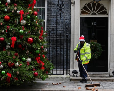 A road sweeper clears the pavement in front of 10 Downing Street in London.