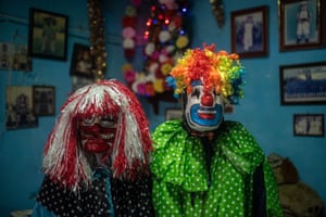 Two people dressed as clowns