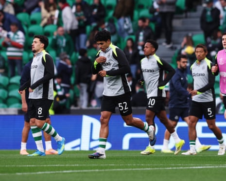 João Simões enters the pitch with teammates to warm up prior to the Champions League quarter-final first leg match between Sporting and Arsenal