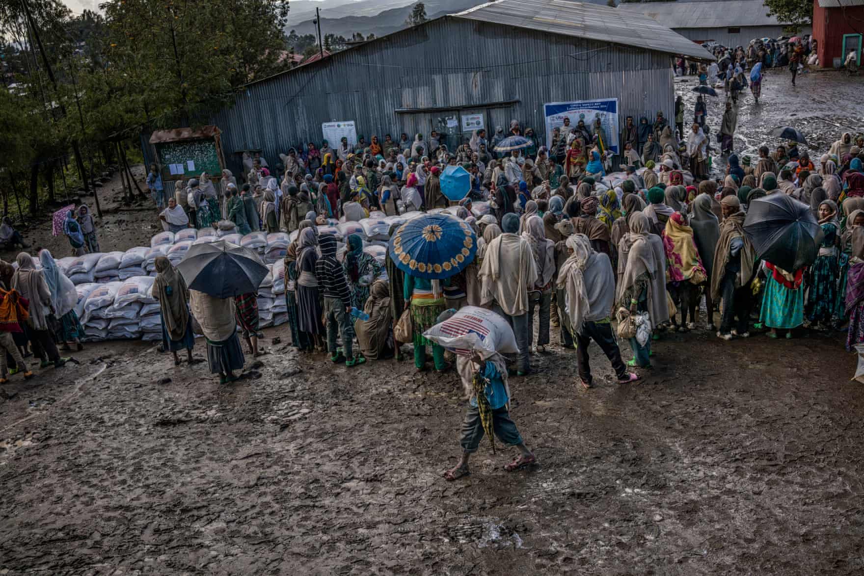 Rural families gather at a muddy compound at the edge of Lalibela to receive sacks of wheat. In January, USAid announced an additional $97m (£79m) in emergency assistance for Ethiopia, to address the crisis triggered by the unusually strong El Niño. Across southern Africa, countries have been appealing for help with the worst drought for 35 years via The Guardian