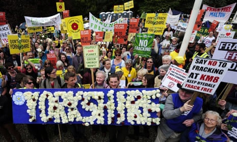 Fracking demonstrators hold up placards at county hall in Northallerton
