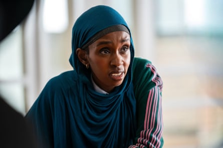 Close up of Sabrina Ali in character, looking incredulous