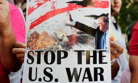 Placard  reads "stop the US war"