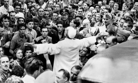 Pope Pius XII addresses a crowd in Rome in 1943 after a US bombing raid.