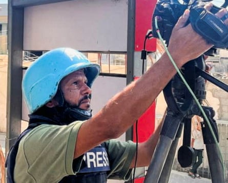 Hussam al-Masri using a camera