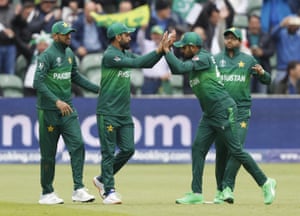 Hafeez, second left celebrates after taking a catch to dismiss Finch.