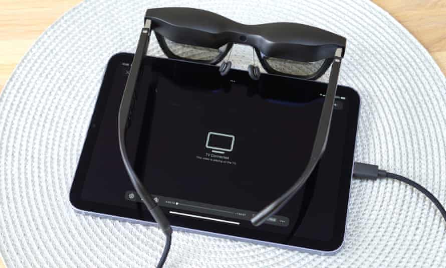 The Nreal Air glasses connected to an iPad mini.