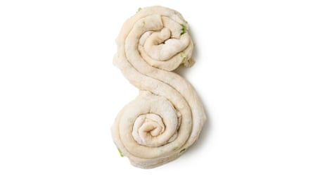 Roll up from one end into a spiral as far as the middle, and then repeat on the opposite side from the other end, so the two meet in adjacent spirals.