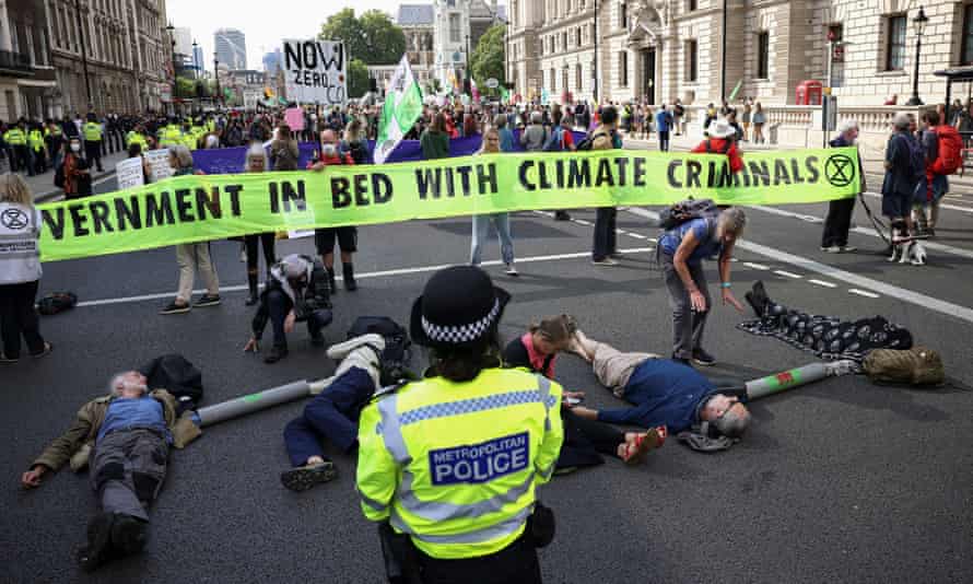 Extinction Rebellion activist protesting against HMRC's links with Barclays bank on Tuesday.