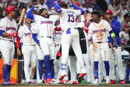 Junior Caminero of the Dominican Republic (13) celebrates with teammates after hitting a home run against Nicaragua during the sixth inning of Friday’s game.