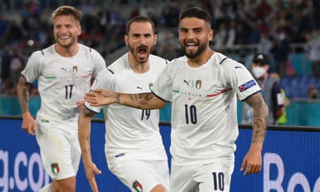 Italy’s Lorenzo Insigne celebrates scoring their third goal with teammates.